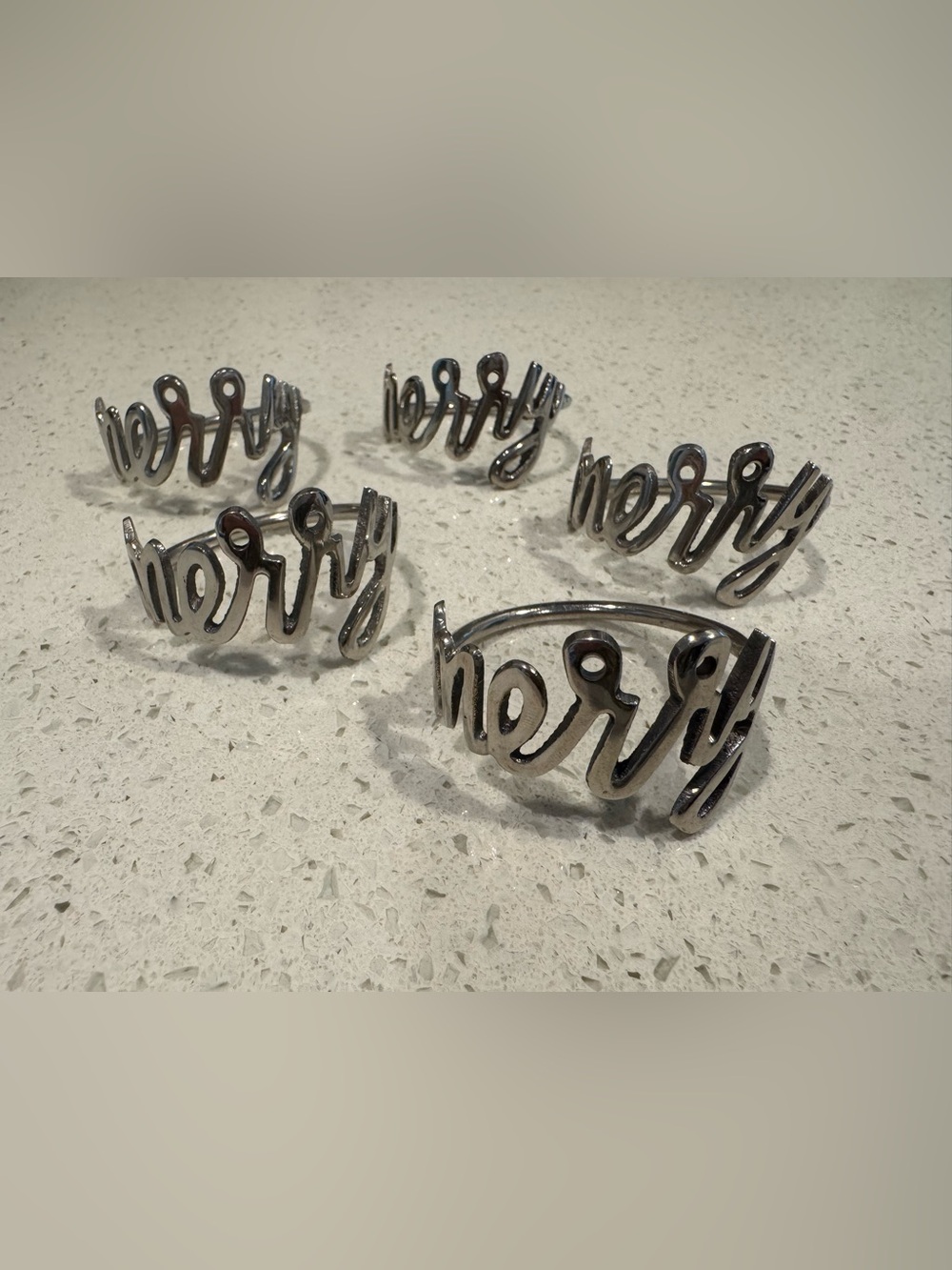 Set of Five Script “Merry” Silver Napkin Rings